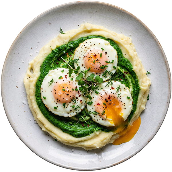 Creamed spinach with mashed potatoe and fried eggs